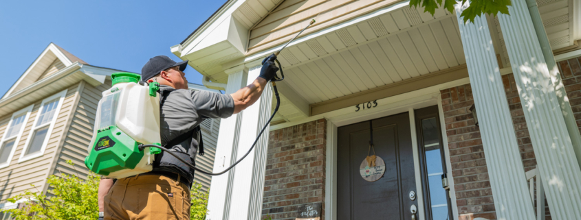 Amco Ranger exterminator conducting a thorough pest inspection in a residential home.