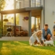 Pet Safe Bug Spray: What Homeowners Should Know Before Spraying 5 Happy family playing with their dog in a backyard treated with pet safe bug spray for a healthy, pest-free home.